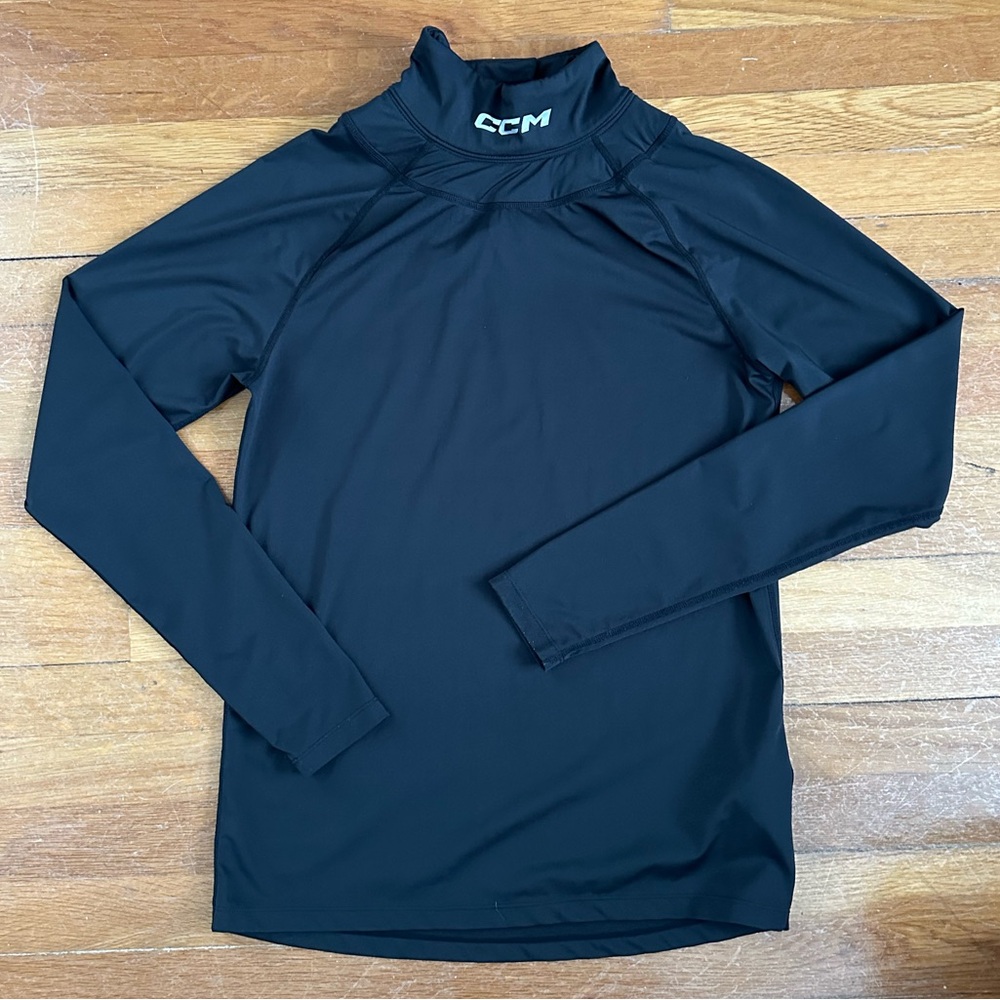 CCM Black compression long sleeve Hockey Shirt with attached neck protector.